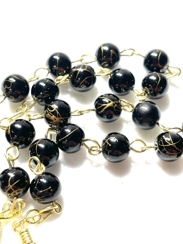 Handmade black crystal glass beaded rosary with gold color swirls
