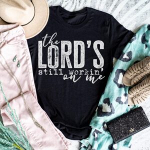 The Lord’s Still Workin On Me Graphic Tee