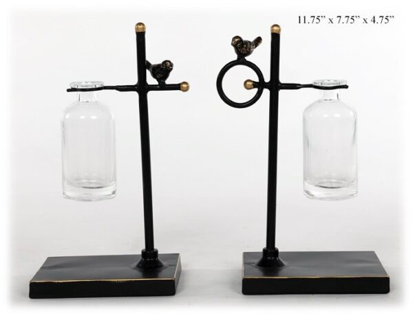 Glass jar on metal stand with bird