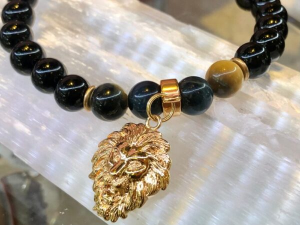 Black onyx and tiger eye 8mm w 18k gold covered lion charm