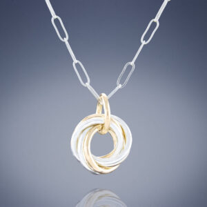 Shop Iowa Two Tone Dainty Love Knot Pendant Necklace in Sterling Silver and 14K Yellow Gold Fill Two Tone Dainty Love Knot Pendant Necklace in Sterling Silver and 14K Yellow Gold Fill