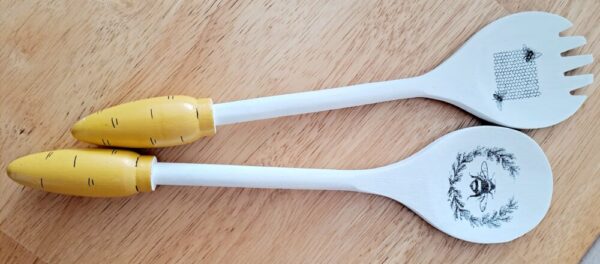 Set of two white and yellow honeybee spoons