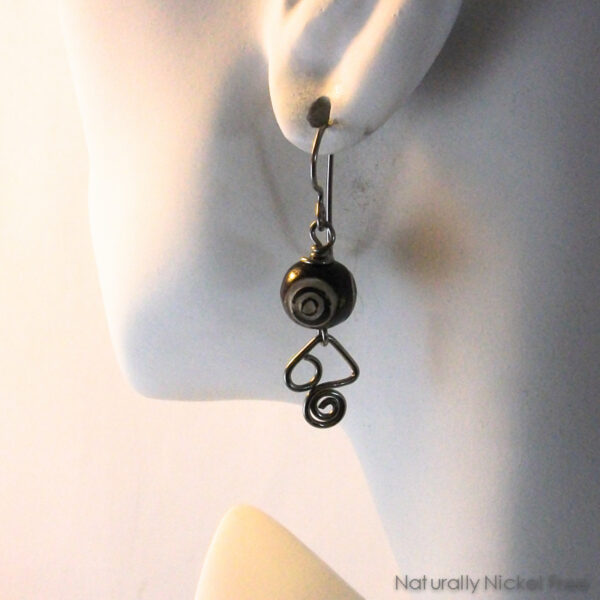 Dzi Style Carved Bead Earrings with Abstract Wire Design