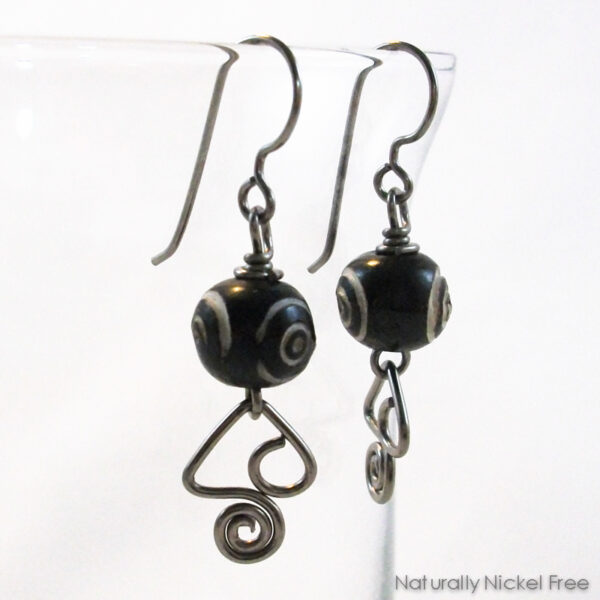 Dzi Style Carved Bead Earrings with Abstract Wire Design