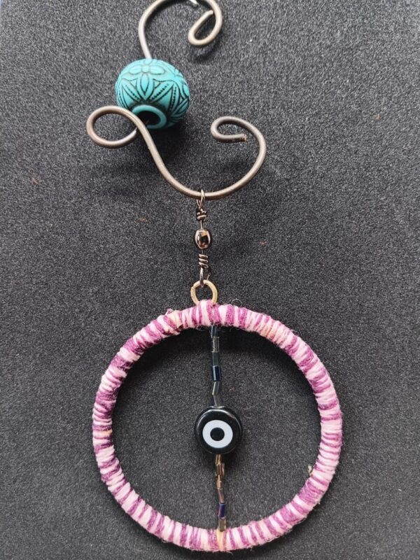 Small evil eye bead on wire hanger