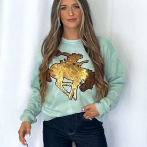 Shop Iowa Crazy Consuela “Gold Sequin Horse” Bleached Western Sweatshirt — Bella + Canvas Aqua Sky Background with Cowboy Patch Crazy Consuela “Gold Sequin Horse” Bleached Western Sweatshirt — Bella + Canvas Aqua Sky Background with Cowboy Patch