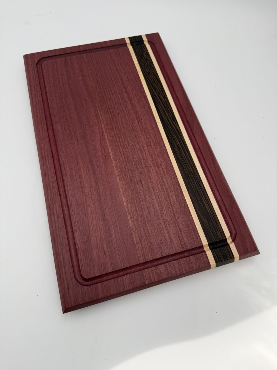 Shop Iowa Exotic Wood Cutting Board, Purple Heart Wenge Maple, Juice Groove, Brass Feet, 16.75x10x.75, Handmade, Food Safe Exotic Wood Cutting Board, Purple Heart Wenge Maple, Juice Groove, Brass Feet, 16.75x10x.75, Handmade, Food Safe