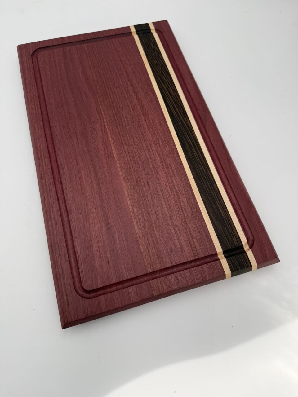 Shop Iowa Exotic Wood Cutting Board, Purple Heart Wenge Maple, Juice Groove, Brass Feet, 16.75x10x.75, Handmade, Food Safe Exotic Wood Cutting Board, Purple Heart Wenge Maple, Juice Groove, Brass Feet, 16.75x10x.75, Handmade, Food Safe
