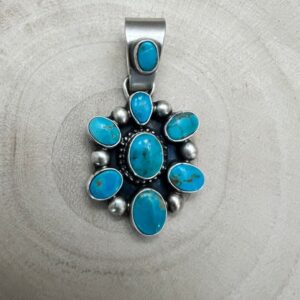 Shop Iowa Kathleen Livingston Navajo Sterling Silver Pendant with Sonoran Gem Turquoise — 1 3/4″ × 7/8″ (Hallmark) Kathleen Livingston Navajo Sterling Silver Pendant with Sonoran Gem Turquoise — 1 3/4″ × 7/8″ (Hallmark)